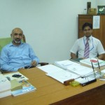 Dr. Saqib Riaz with a colleague in his office